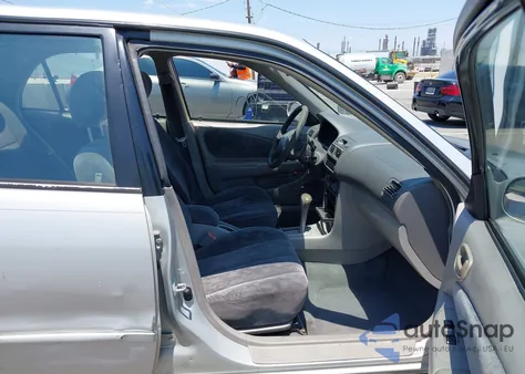 1999 Toyota Corolla Le from USA, damaged, VIN 1NXBR12E1XZ206875